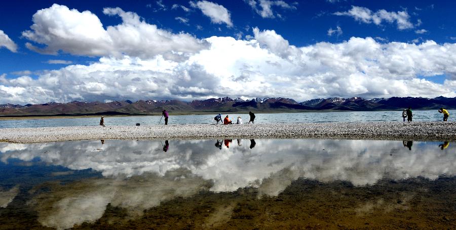 Tourists visit Lake Namsto, June 23. Summer is the best time to visit Lake Namsto, Nagqu Prefecture. The lake, China's second largest saltwater lake next to the Qinghai Lake in NW China's Qinghai Province, is located at an elevation of 4,718 meters and has a total area of more than 1,920 square km. The lake is currently in process of building itself into a high-end tourism attraction in planned steps, according to regional tourism depertment in Nagqu Prefecture, northern Tibet.
