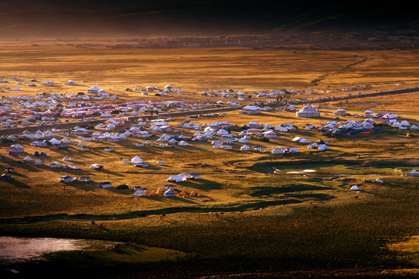 Tibetan style houses on Litang grassland in Litang County of Garze Tibetan Autonomous Prefecture in Sichuan Province.