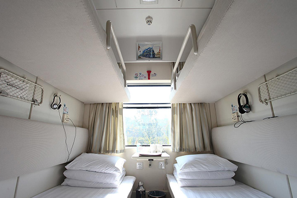  Soft sleeper cabin with mesh bags on the wall for each berth
 